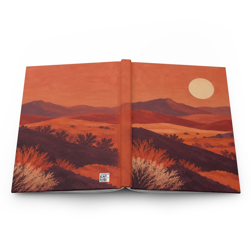 Terracotta Desert hardcover journal shown open flat, layered terracotta desert hills under a pale sun wrapping across the front, spine and back cover