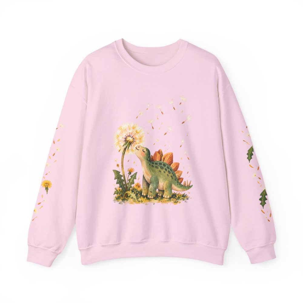 Dinosaur and Dandelion crewneck sweatshirt in light pink, a friendly green stegosaurus looking up at an oversized dandelion on the front with matching prints down both sleeves