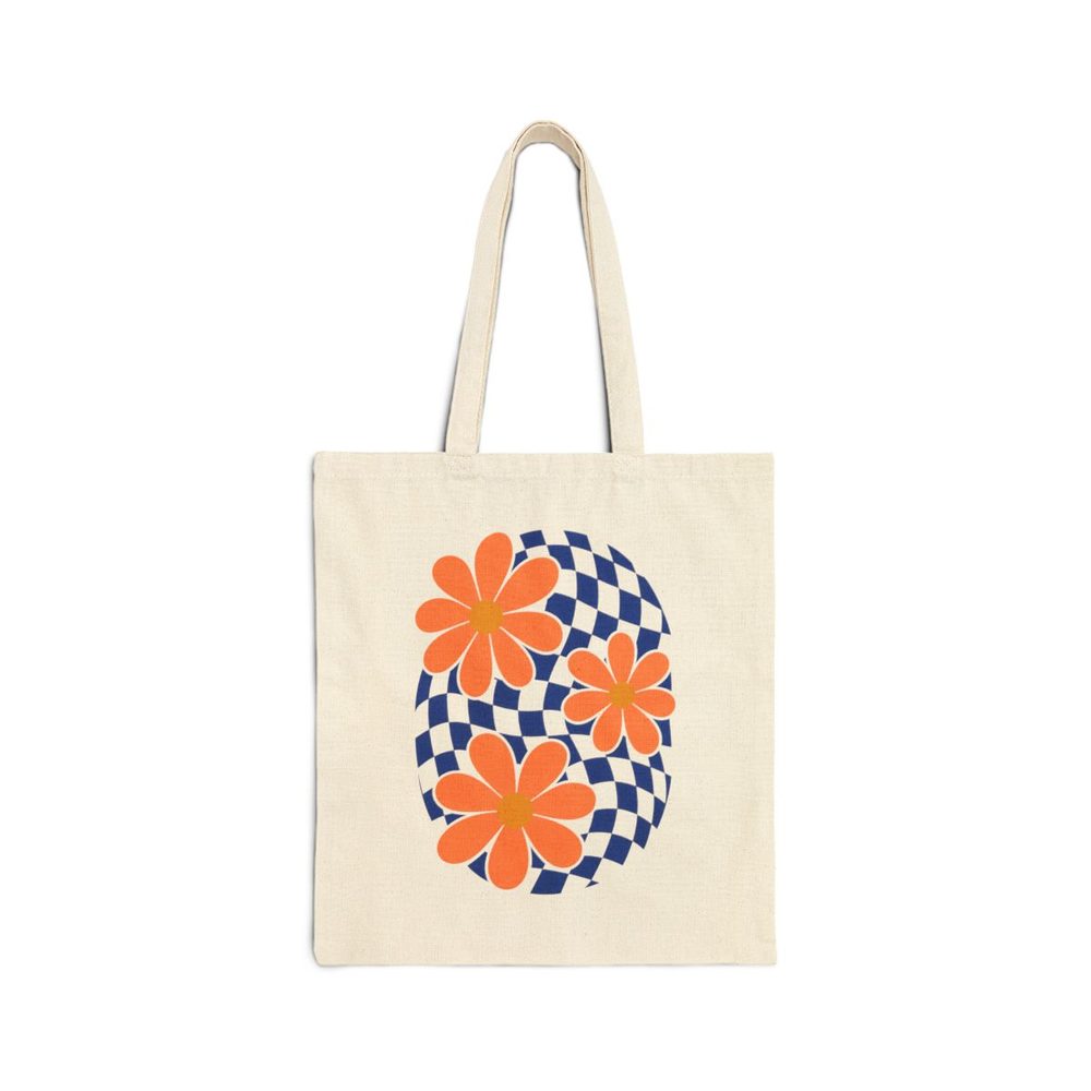 Retro Daisy and Blue Checker tote bag in natural cotton canvas, printed with oversized orange daisies over a wavy cobalt and white checkerboard